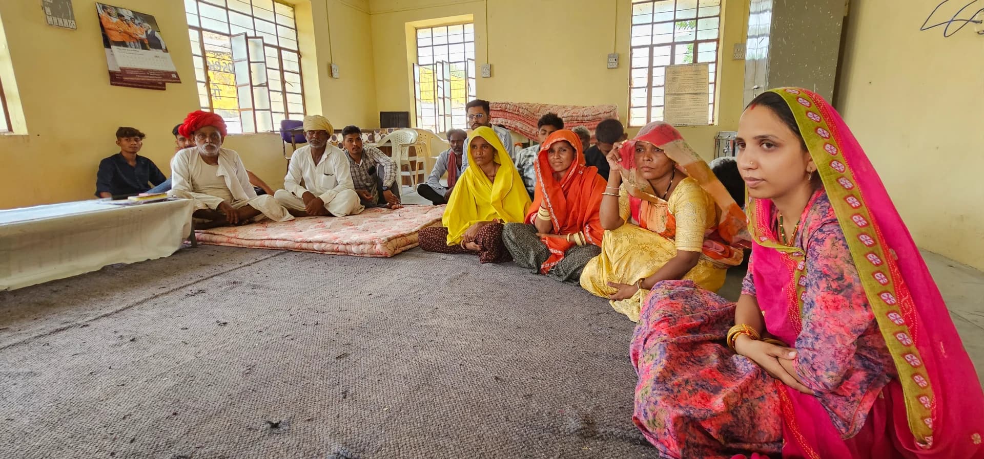 Pani Mitras and community members in a Pause and Reflect deliberation session