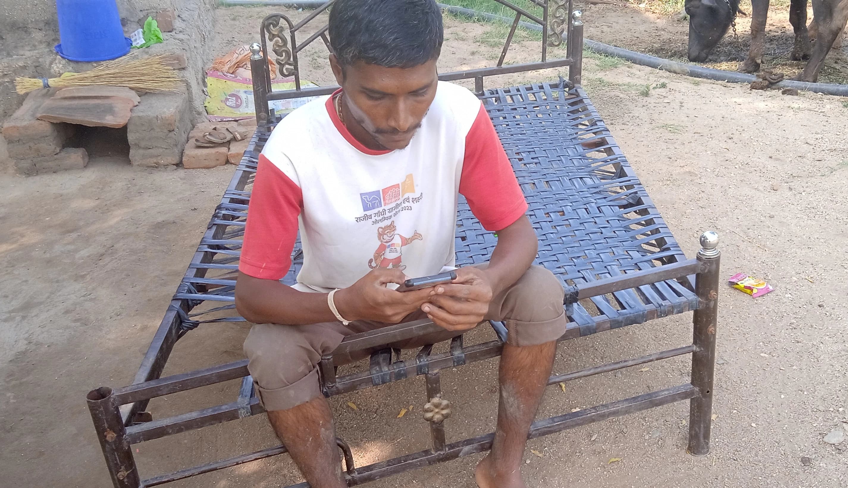Frontline workers helping community members record voice-note interview responses